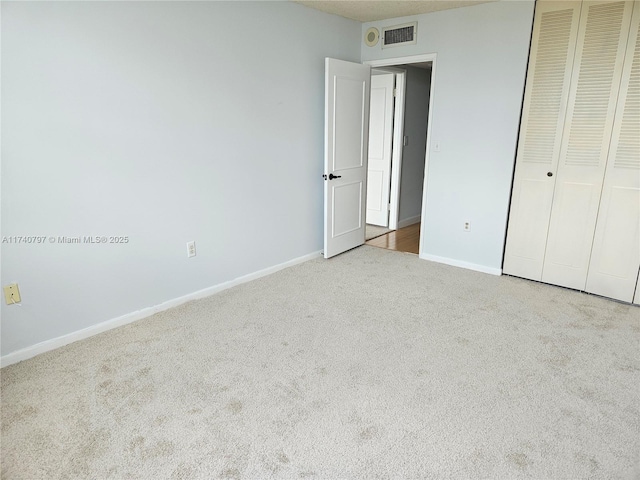 2801 NE 183rd St Unit 517W, Aventura, FL 33160 - unfurnished bedroom with carpet, baseboards, and a closet