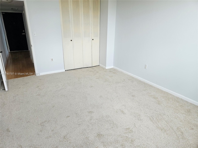 2801 NE 183rd St Unit 517W, Aventura, FL 33160 - unfurnished bedroom featuring carpet, baseboards, and a closet