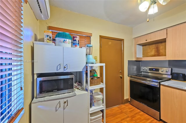 kitchen with stainless steel appliances and light brown cabinetry