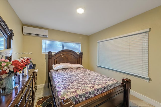 bedroom featuring light tile patterned floors and a wall unit AC