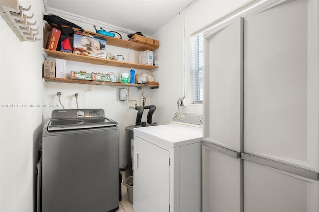 laundry area with washing machine and clothes dryer