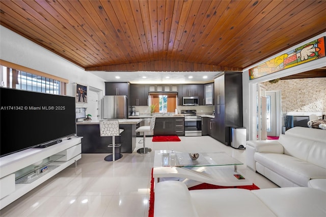 tiled living room featuring plenty of natural light, sink, vaulted ceiling, and wooden ceiling