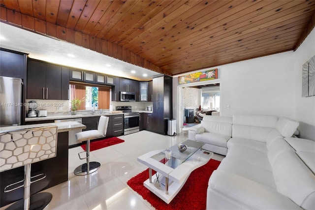 tiled living room with lofted ceiling, sink, and wood ceiling