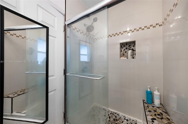 bathroom featuring an enclosed shower