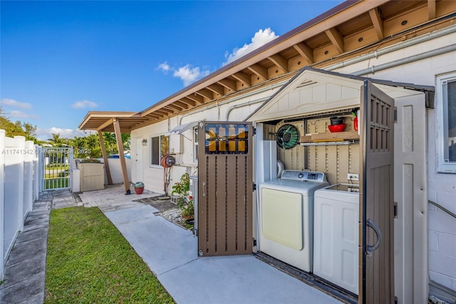 exterior space featuring washing machine and dryer and a patio area