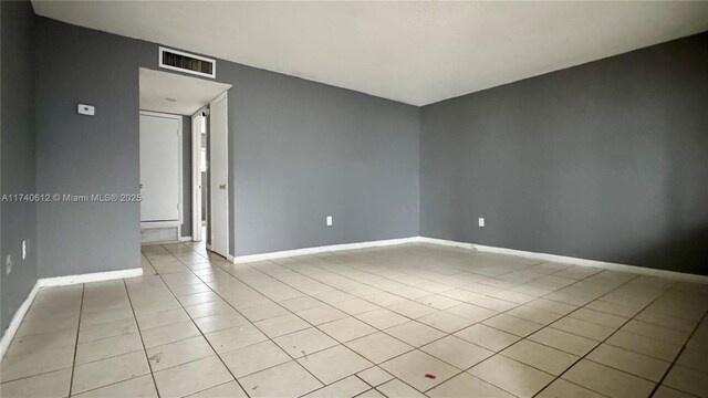 full bathroom featuring tiled shower / bath, vanity, toilet, and tile patterned floors