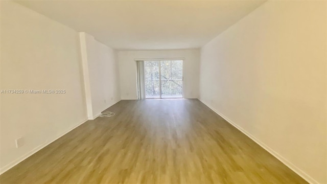 unfurnished room featuring light hardwood / wood-style flooring