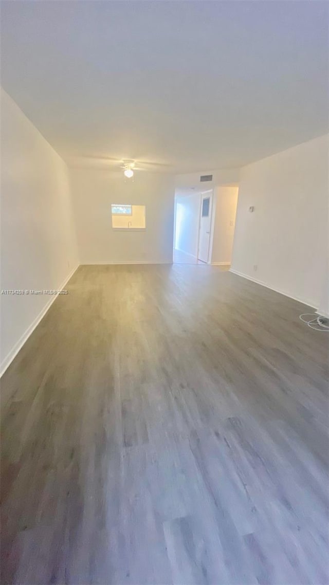 spare room featuring hardwood / wood-style flooring
