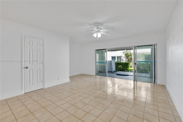 1194 Hillsboro Mile Unit 72, Hillsboro Beach, FL 33062 - unfurnished room with a ceiling fan, light tile patterned flooring, and baseboards