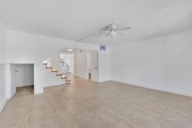 1194 Hillsboro Mile Unit 72, Hillsboro Beach, FL 33062 - unfurnished room featuring ceiling fan, stairs, a textured ceiling, light tile patterned floors, and baseboards