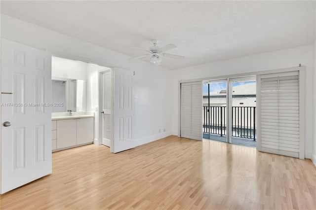 1194 Hillsboro Mile Unit 72, Hillsboro Beach, FL 33062 - empty room featuring a ceiling fan, light wood finished floors, baseboards, and a sink
