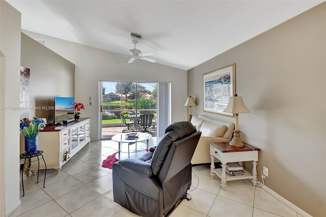 tiled living room with ceiling fan and lofted ceiling