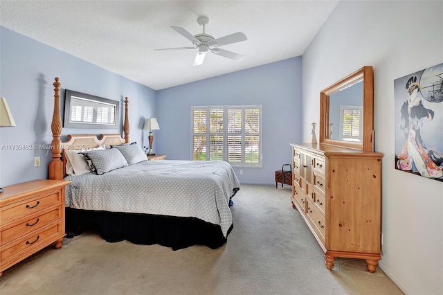 carpeted bedroom with lofted ceiling, multiple windows, and ceiling fan