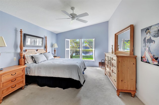 carpeted bedroom with lofted ceiling and ceiling fan