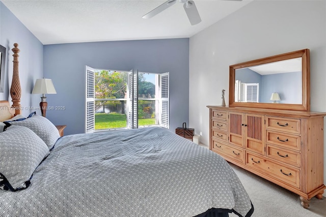 carpeted bedroom with vaulted ceiling and ceiling fan