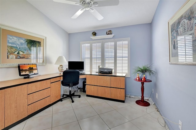 tiled home office featuring vaulted ceiling and ceiling fan