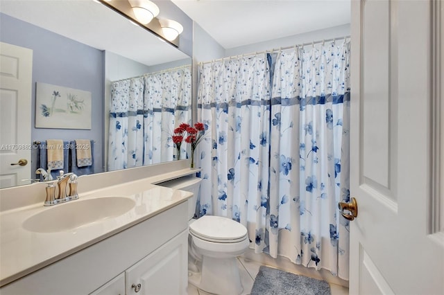 bathroom featuring vanity, curtained shower, and toilet