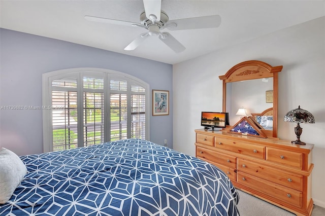 bedroom featuring ceiling fan and multiple windows