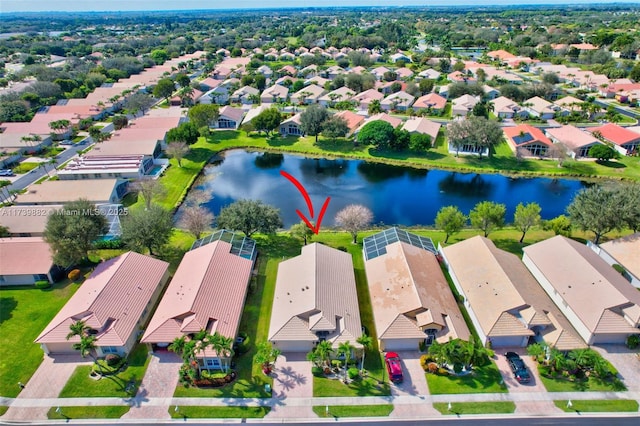 birds eye view of property with a water view