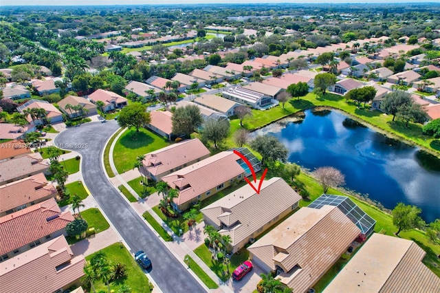 birds eye view of property featuring a water view