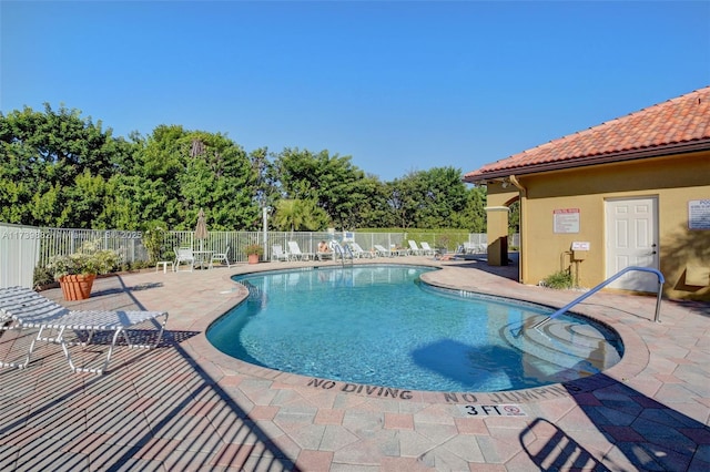 view of swimming pool featuring a patio