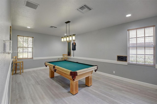 rec room featuring billiards, a textured ceiling, and light wood-type flooring