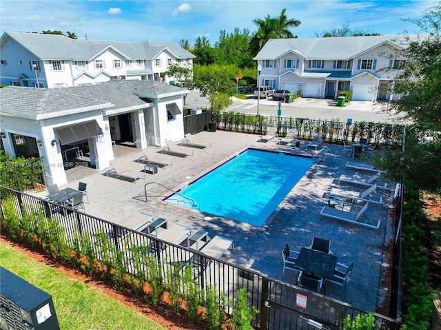 view of swimming pool with a patio area