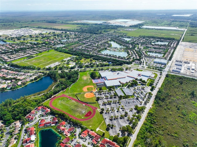 birds eye view of property featuring a water view