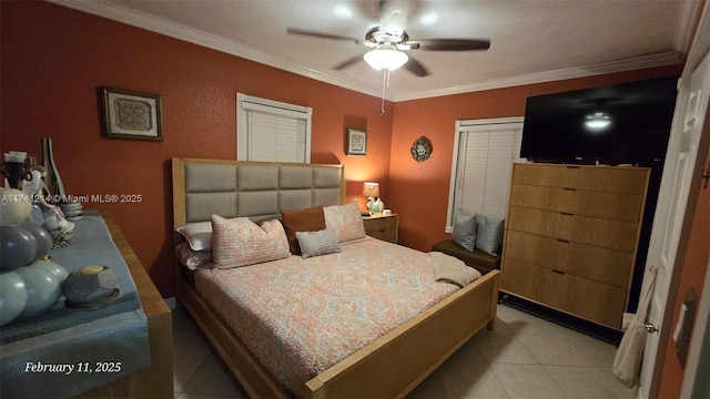 tiled bedroom with ornamental molding and ceiling fan