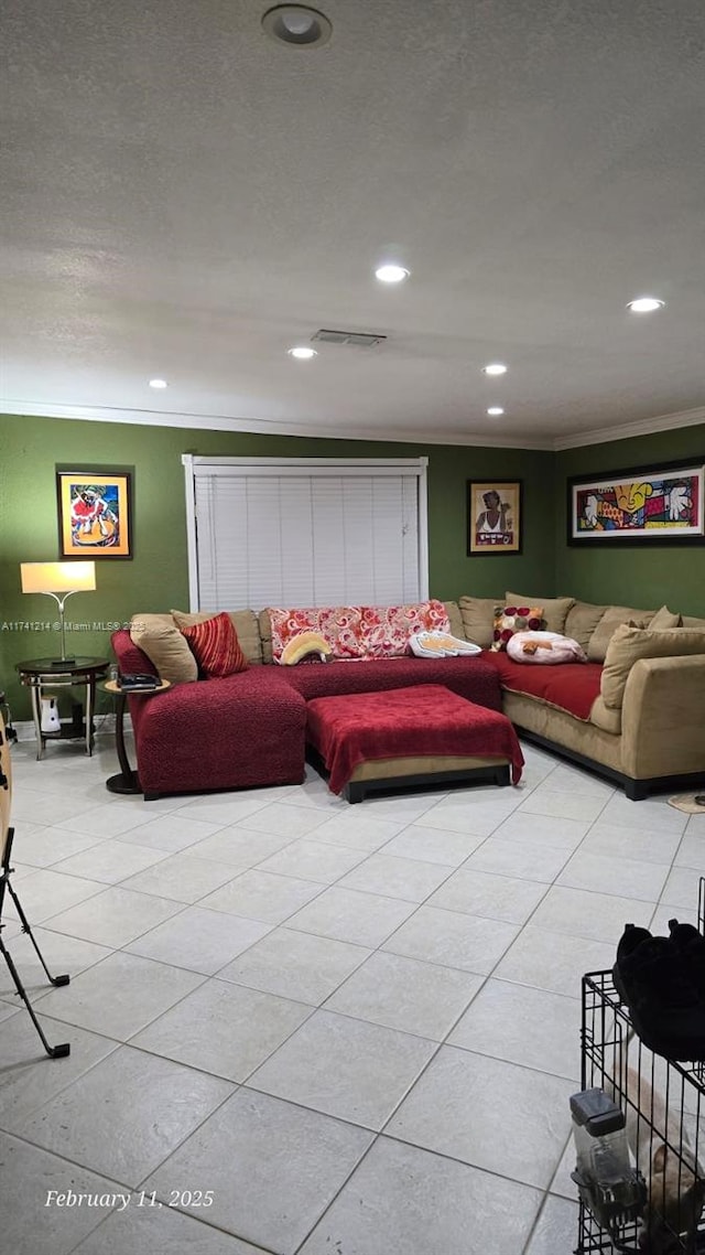 living room featuring crown molding, light tile patterned floors, and a textured ceiling