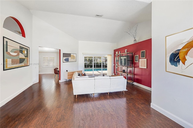 living room with high vaulted ceiling and dark hardwood / wood-style flooring