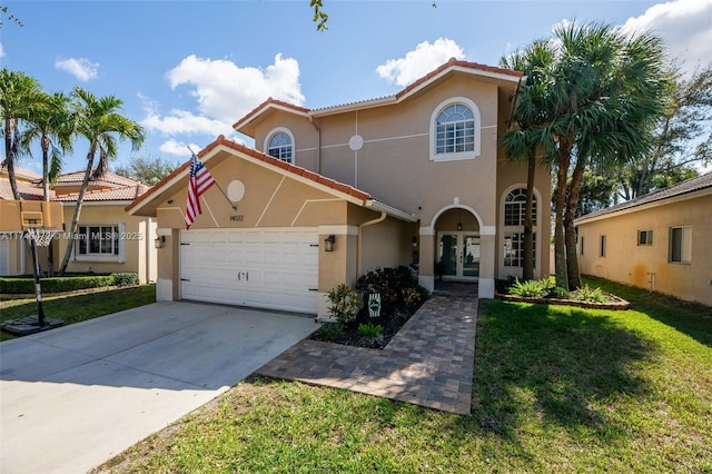 mediterranean / spanish house with a front yard