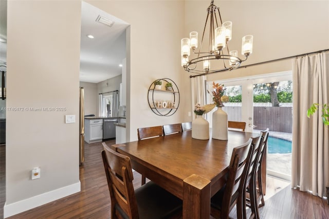 dining space with dark hardwood / wood-style floors