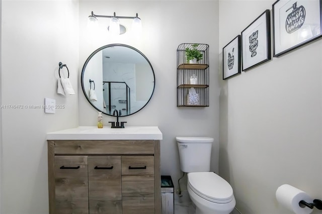 bathroom featuring walk in shower, vanity, and toilet