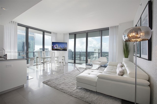 living room with expansive windows and an inviting chandelier