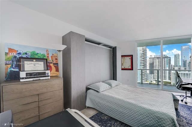 bedroom featuring expansive windows