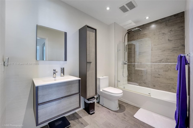 1900 N Bayshore Dr Unit 2004, Miami, FL 33132 - bathroom featuring wood finished floors, vanity, toilet, shower / tub combination, and recessed lighting