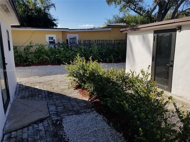 exterior space featuring an outdoor structure and a patio area