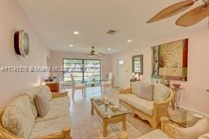 living room featuring ceiling fan