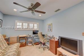 carpeted office with ceiling fan