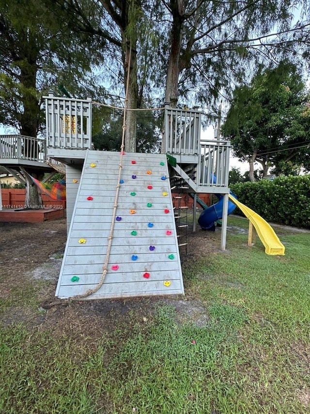 view of jungle gym with a lawn