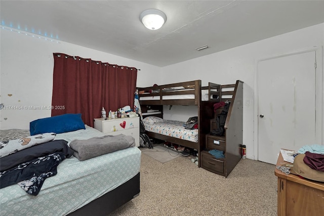 bedroom featuring light carpet