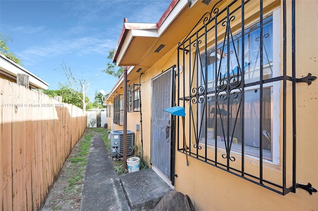 view of side of home featuring cooling unit