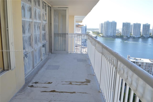 balcony featuring a water view