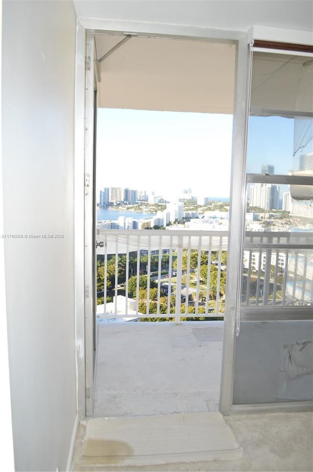 entryway featuring concrete floors and a city view