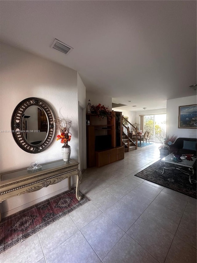 hall with light tile patterned flooring