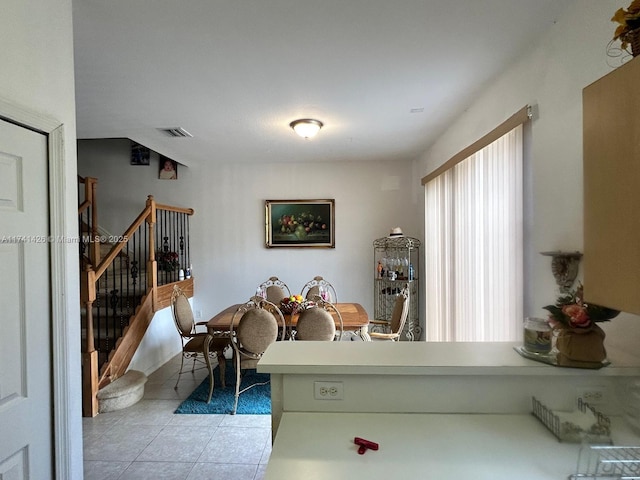 dining room featuring light tile patterned floors