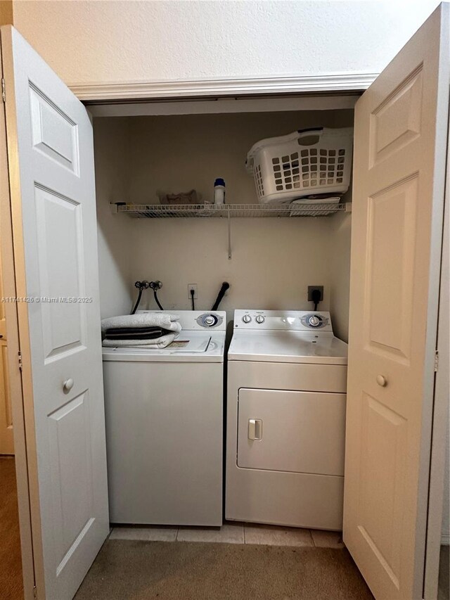 laundry area with washing machine and dryer