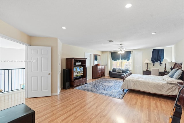 bedroom featuring ceiling fan and light hardwood / wood-style flooring