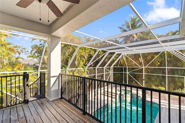 wooden terrace featuring a lanai and a patio area